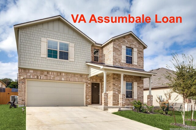 view of front facade featuring a garage and a front lawn