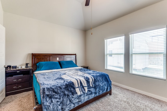 carpeted bedroom featuring vaulted ceiling and ceiling fan