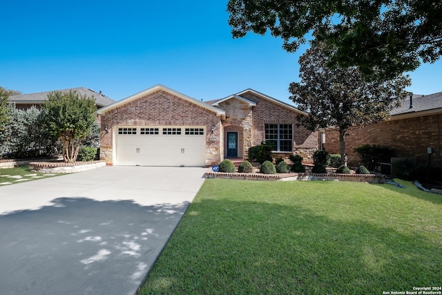 view of front of property with concrete driveway, a front lawn, brick siding, and a garage