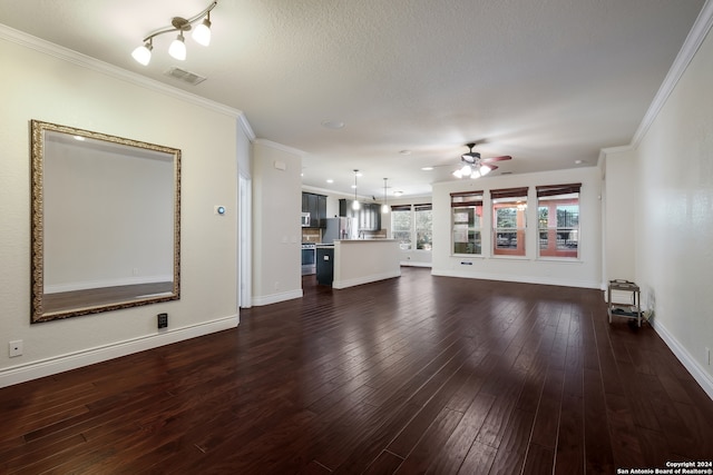 unfurnished living room featuring crown molding, a textured ceiling, dark hardwood / wood-style floors, and ceiling fan