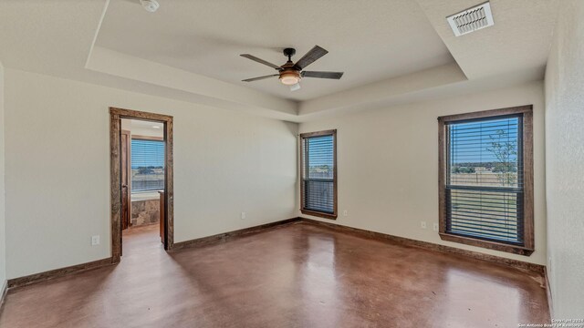 165 Lakeview Cir, La Vernia, TX 78121 - unfurnished room featuring ceiling fan, a textured ceiling, and a raised ceiling