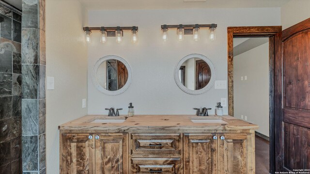 165 Lakeview Cir, La Vernia, TX 78121 - bathroom featuring vanity and wood-type flooring