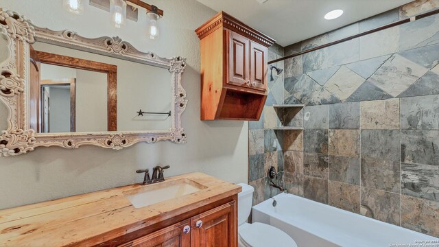 165 Lakeview Cir, La Vernia, TX 78121 - full bathroom featuring tiled shower / bath, vanity, and toilet