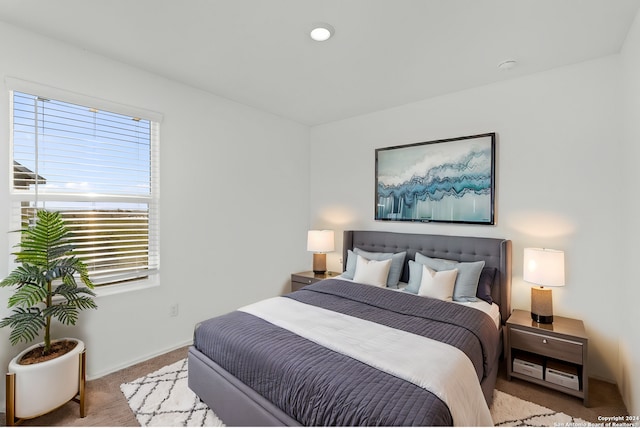 bedroom featuring light colored carpet