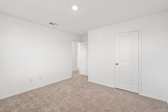 385 Soapstone Pass, Maxwell, TX 78656 - unfurnished bedroom featuring recessed lighting, light carpet, visible vents, and baseboards