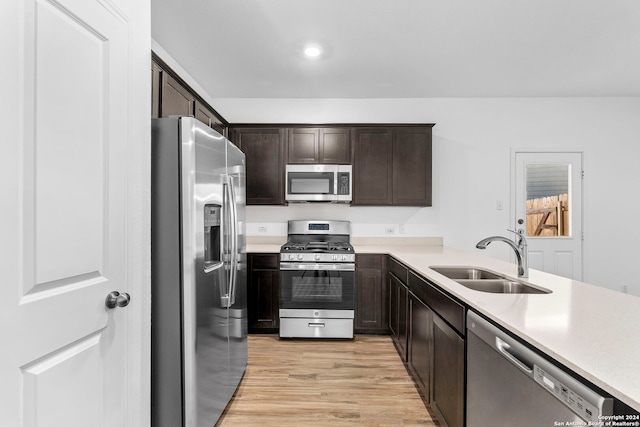 385 Soapstone Pass, Maxwell, TX 78656 - kitchen featuring dark brown cabinetry, stainless steel appliances, light countertops, and a sink