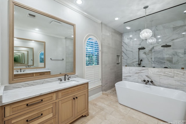 bathroom with shower with separate bathtub, vanity, ornamental molding, an inviting chandelier, and tile patterned flooring