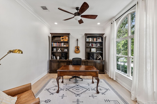 office featuring plenty of natural light, ceiling fan, and light wood-type flooring