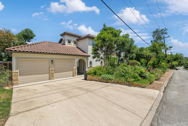 view of front of property featuring a garage