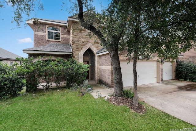 view of front of house featuring driveway, an attached garage, a front yard, and brick siding