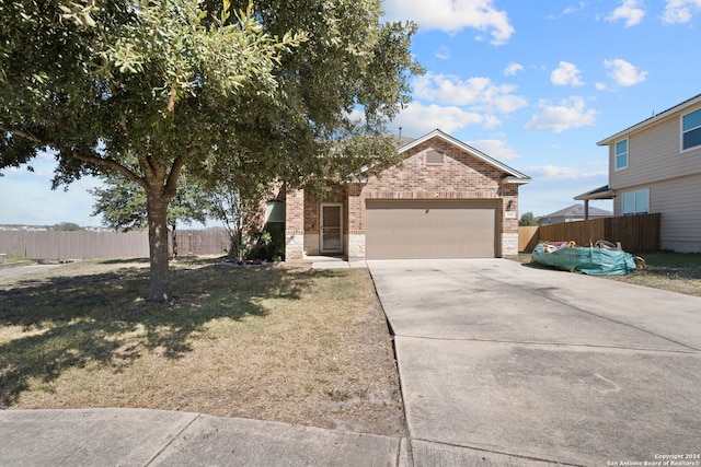 view of front of home with a garage and a front yard