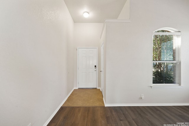 corridor featuring wood-type flooring