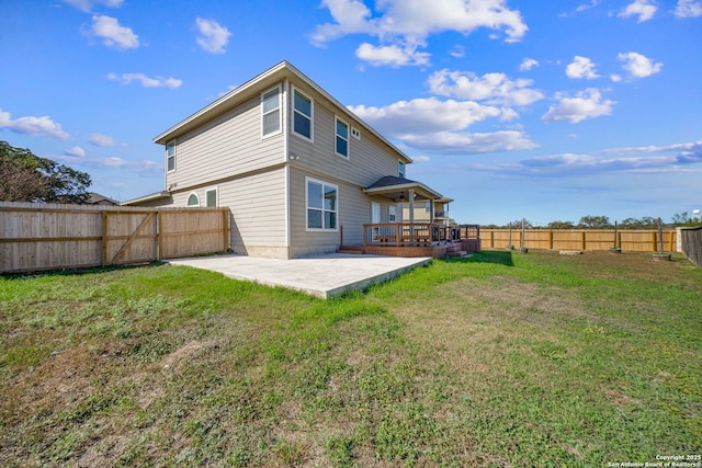 back of house with a patio, a deck, and a lawn