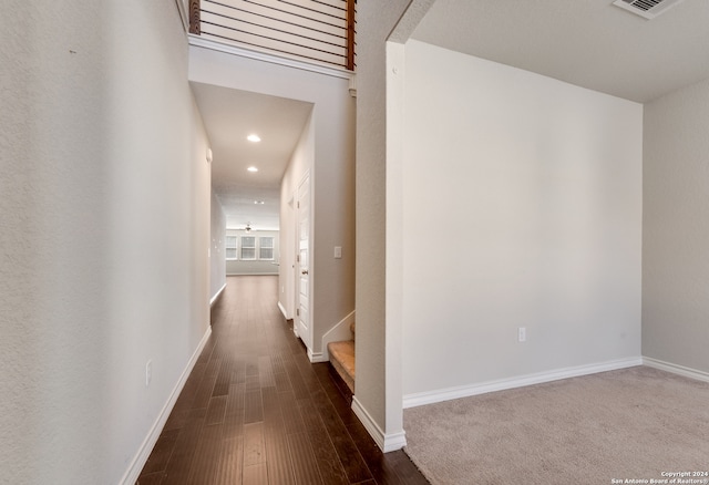 hallway featuring dark hardwood / wood-style flooring