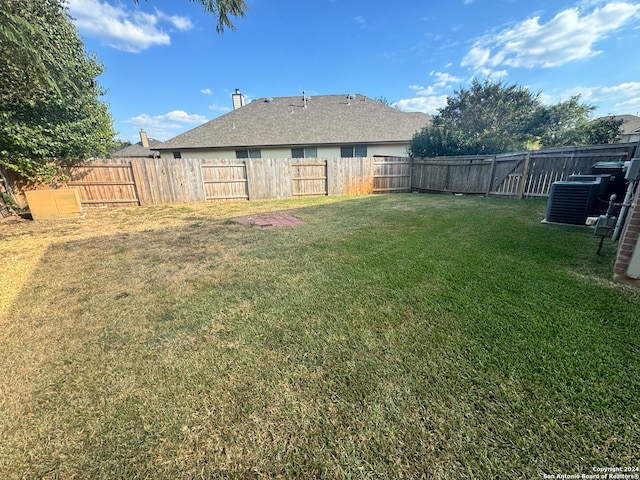 view of yard with central AC unit