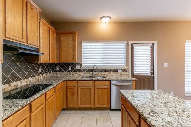 kitchen featuring black electric stovetop, light stone countertops, light tile patterned flooring, sink, and stainless steel dishwasher