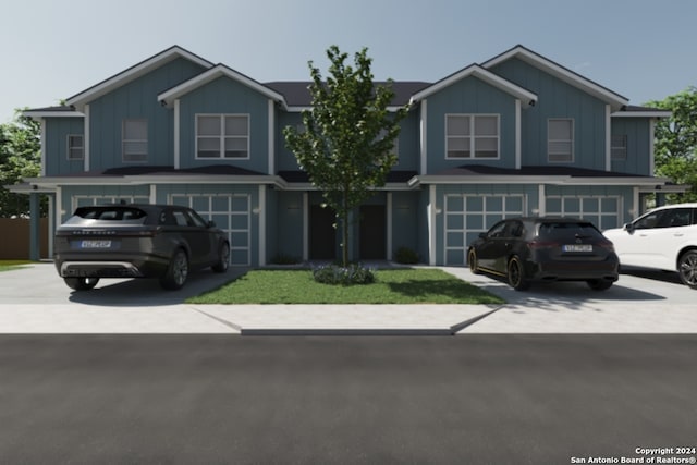 view of front of home with a front yard and a garage