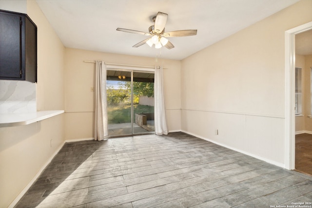 unfurnished dining area with wood-type flooring and ceiling fan