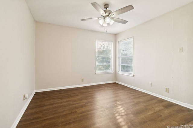 empty room featuring dark hardwood / wood-style floors and ceiling fan