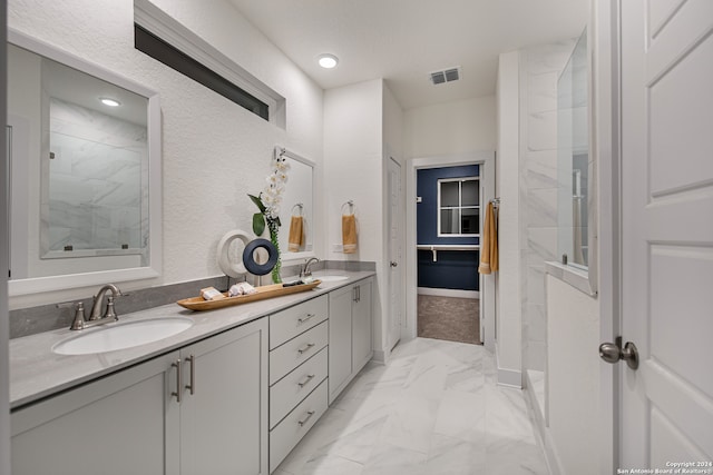 bathroom with vanity and walk in shower