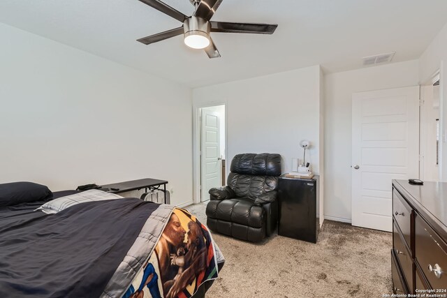 carpeted bedroom featuring ceiling fan