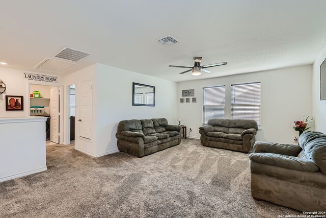 carpeted living room featuring ceiling fan