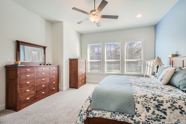 carpeted bedroom with ceiling fan