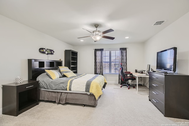 bedroom featuring light colored carpet and ceiling fan