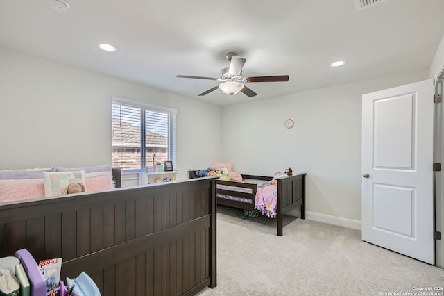 bedroom with light colored carpet and ceiling fan