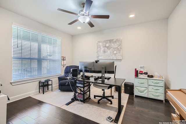 office area featuring dark hardwood / wood-style floors and ceiling fan