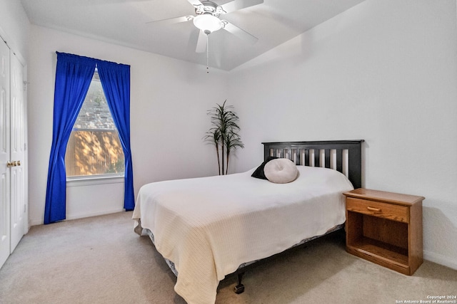 carpeted bedroom with ceiling fan