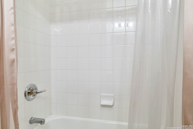 bathroom featuring shower / bath combo with shower curtain