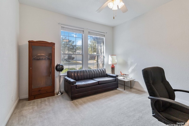 carpeted home office with ceiling fan