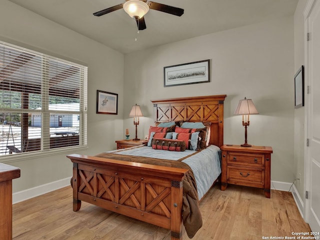 bedroom featuring light hardwood / wood-style flooring and ceiling fan