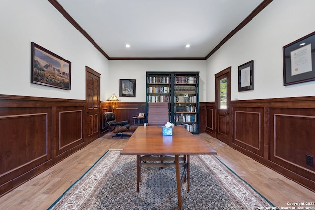 office space with ornamental molding and light hardwood / wood-style flooring