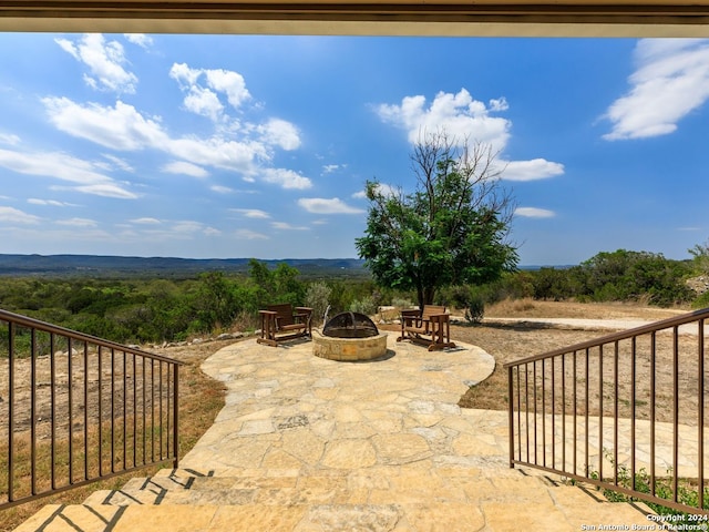 view of patio / terrace with a fire pit