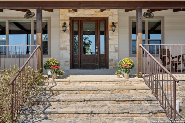 property entrance featuring covered porch