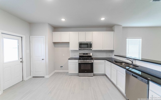 6523 Scooby Acres, San Antonio, TX 78253 - kitchen with stainless steel appliances, a sink, decorative backsplash, white cabinetry, and recessed lighting