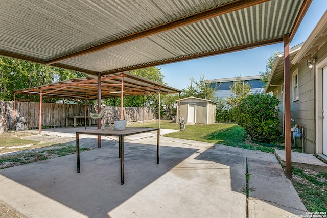 view of patio / terrace with a shed