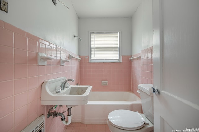 bathroom featuring toilet, tile walls, sink, and tile patterned flooring