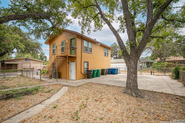 rear view of property featuring a patio