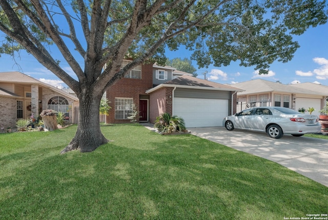 view of front of home featuring a front yard and a garage