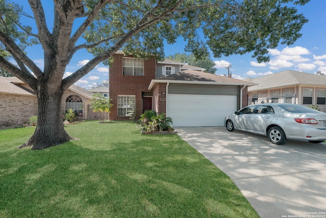 view of front of property featuring a front yard and a garage