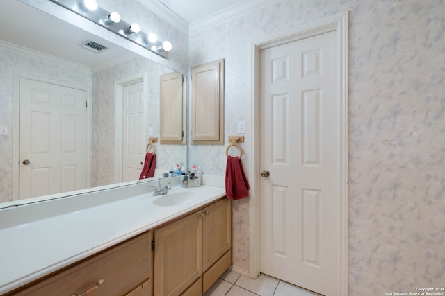 bathroom with vanity, crown molding, and tile patterned flooring