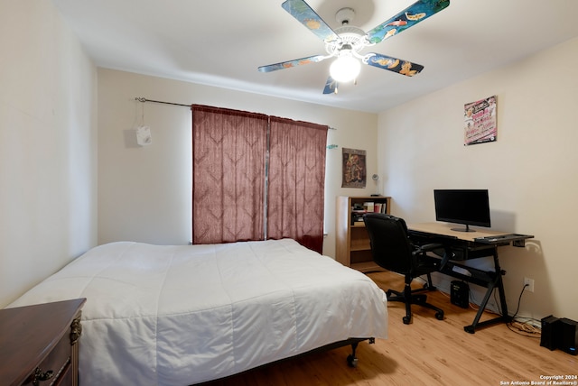 bedroom with light wood-type flooring and ceiling fan