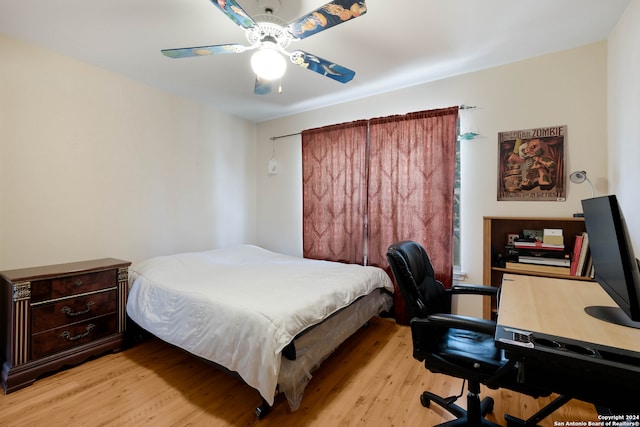 bedroom with ceiling fan and light hardwood / wood-style flooring