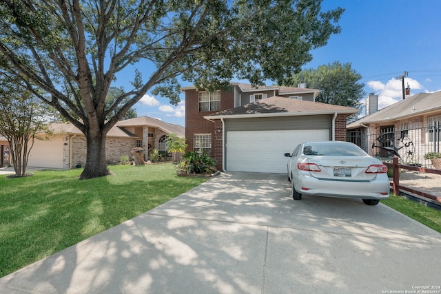 view of front of property featuring a front lawn and a garage