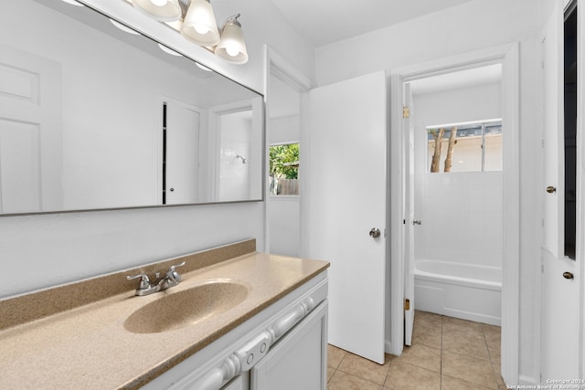 bathroom featuring vanity, washtub / shower combination, and tile patterned flooring