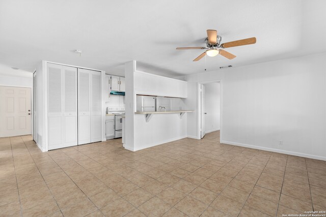 interior space featuring ceiling fan