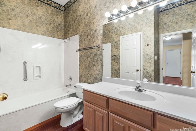 full bathroom with vanity, toilet, shower / bathing tub combination, and wood-type flooring